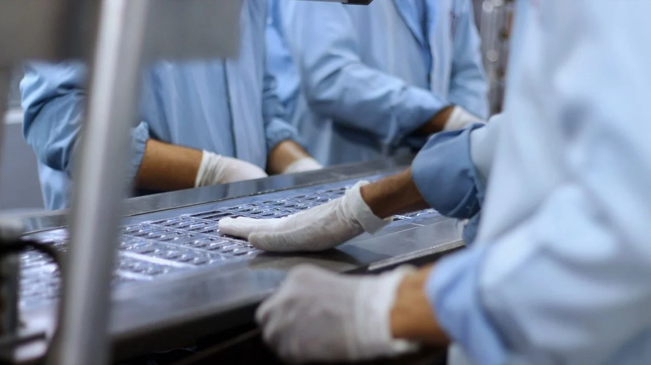 Technician working in a clean production area